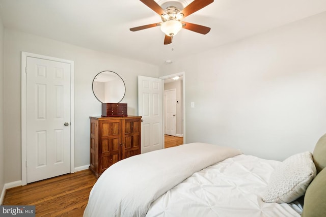 bedroom with hardwood / wood-style floors and ceiling fan