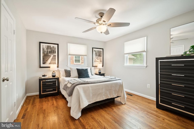 bedroom featuring wood-type flooring and ceiling fan