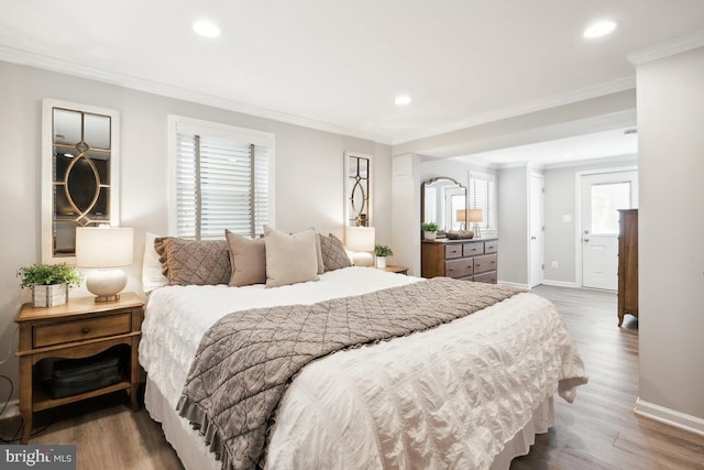 bedroom featuring wood-type flooring and ornamental molding