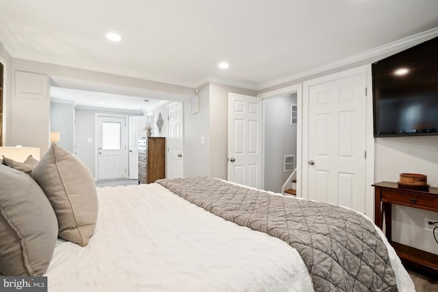 bedroom with crown molding and wood-type flooring