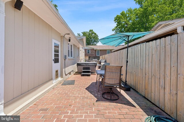 view of patio featuring a hot tub