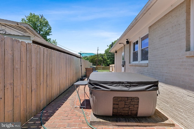 view of patio with a hot tub