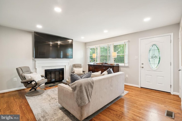 living room with light hardwood / wood-style flooring