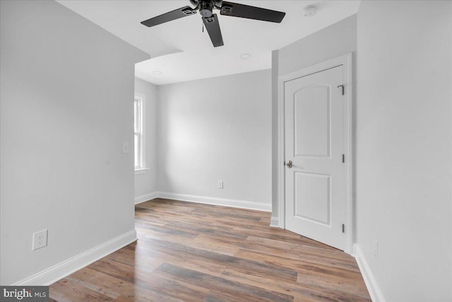 spare room with ceiling fan and hardwood / wood-style floors