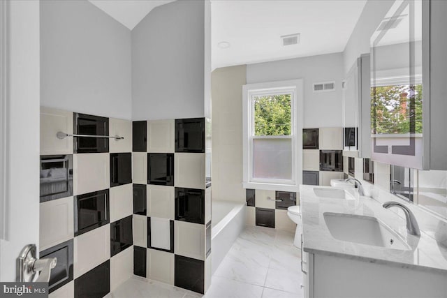 full bathroom with dual vanity, toilet, tile patterned floors, and bathtub / shower combination