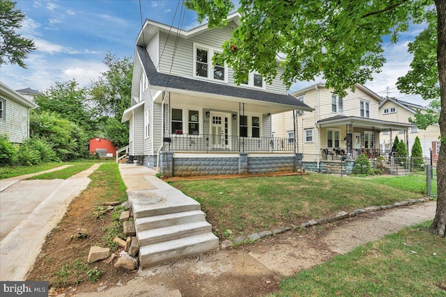 view of front of property with a porch and a front lawn