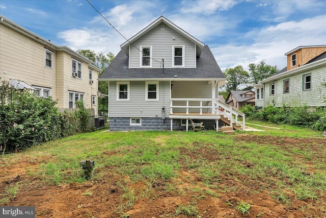 rear view of house with a lawn