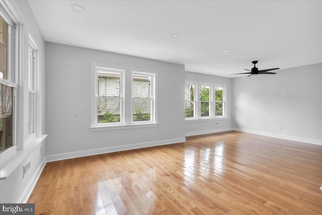 empty room featuring light hardwood / wood-style floors and ceiling fan