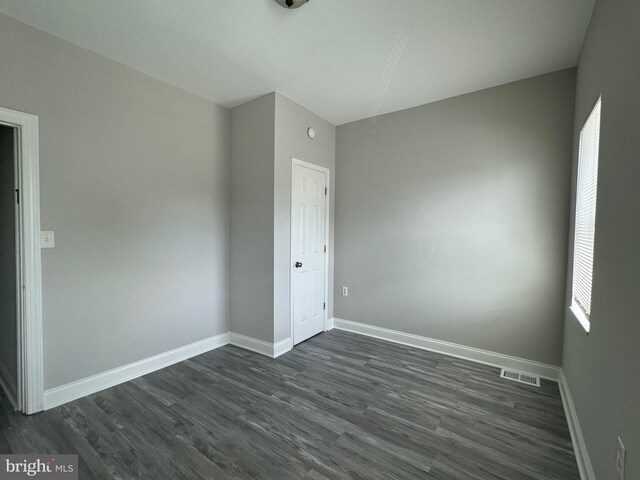 empty room featuring dark hardwood / wood-style floors