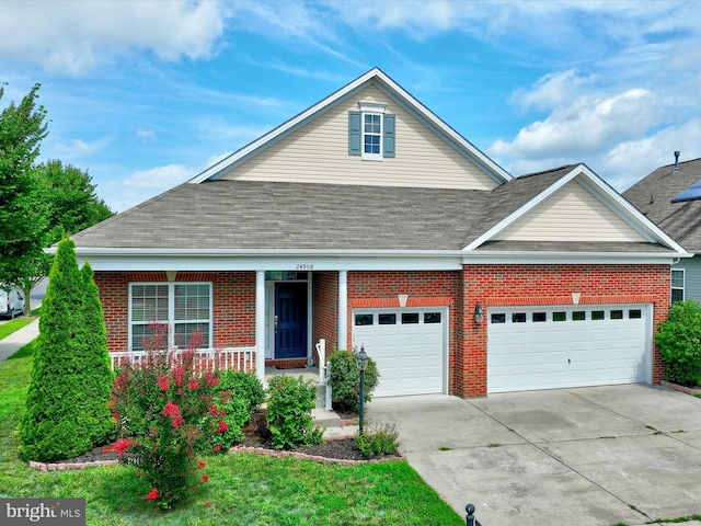 view of front of property featuring a porch and a garage