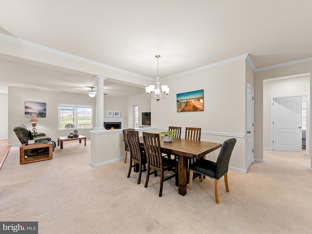 dining room featuring light carpet, ceiling fan with notable chandelier, and ornamental molding