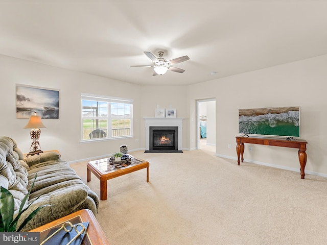 carpeted living room with ceiling fan