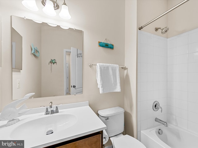 full bathroom featuring vanity, toilet, and tiled shower / bath