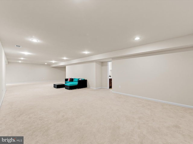 unfurnished room featuring light carpet