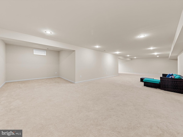 basement with light colored carpet