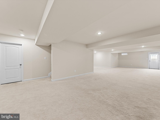 basement with light colored carpet