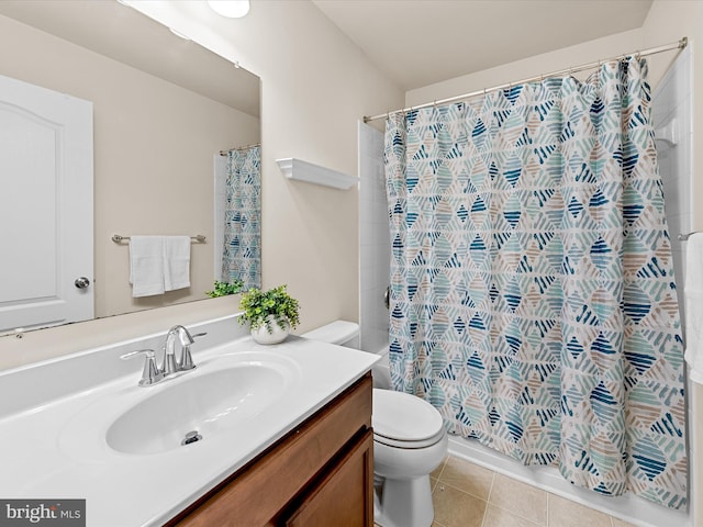 bathroom with tile patterned floors, vanity, toilet, and curtained shower