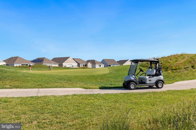 view of property's community featuring a lawn