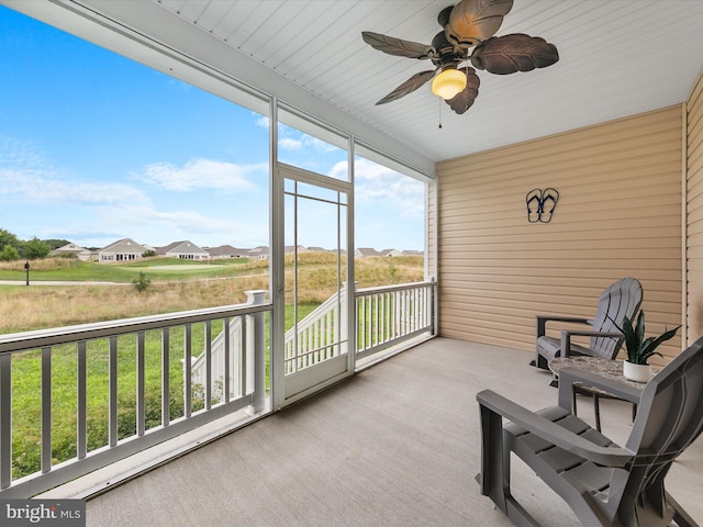 sunroom featuring plenty of natural light and ceiling fan