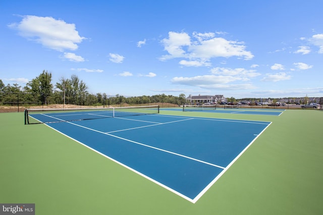 view of tennis court featuring basketball court