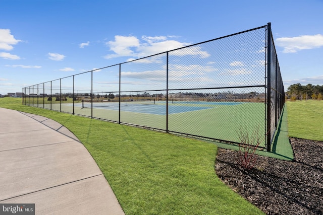 view of sport court featuring a yard