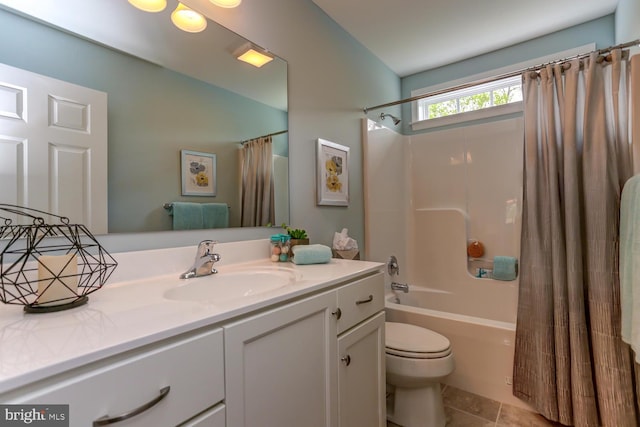 full bathroom with vanity, tile patterned floors, shower / bath combo, and toilet