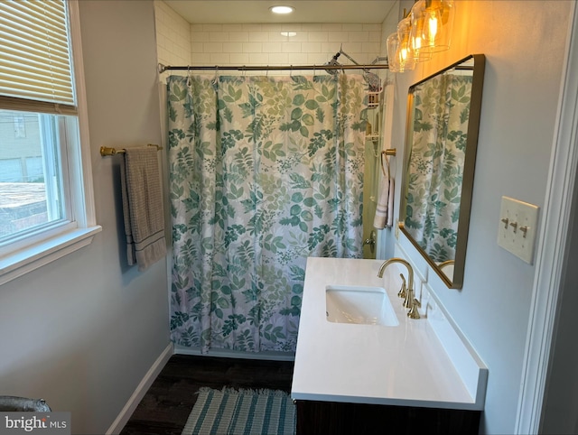 bathroom with wood-type flooring and vanity