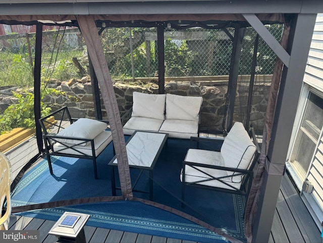 wooden deck featuring an outdoor living space