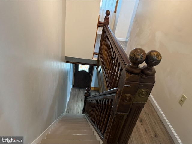 stairway featuring hardwood / wood-style flooring