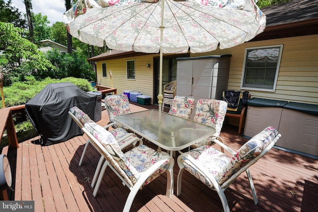 wooden deck with area for grilling