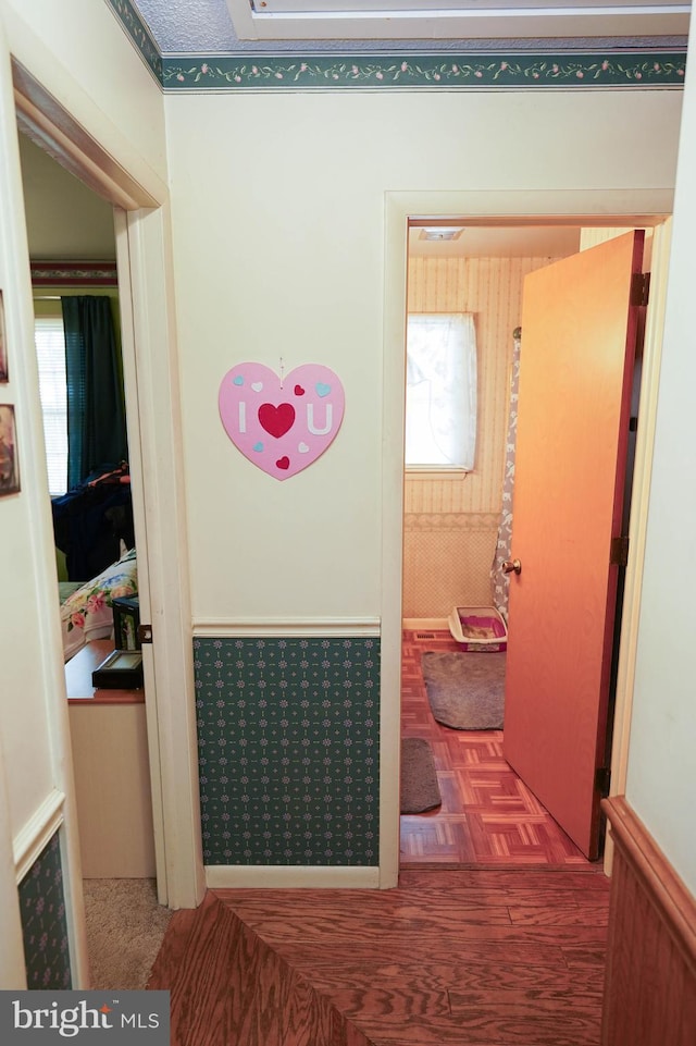 hallway with parquet flooring