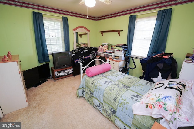 bedroom with ceiling fan and light colored carpet