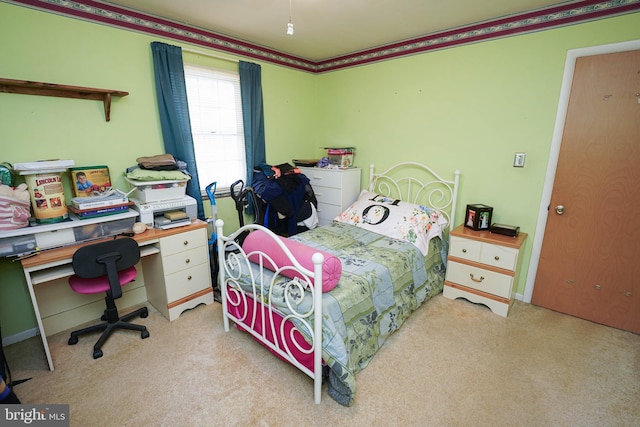 bedroom with light carpet and ornamental molding