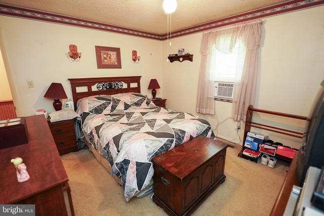 bedroom with cooling unit, light colored carpet, and a textured ceiling