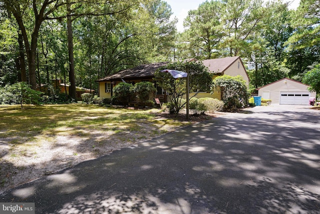 view of front of house with an outdoor structure and a garage