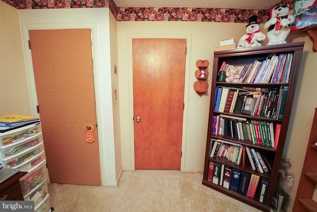 hallway with light carpet