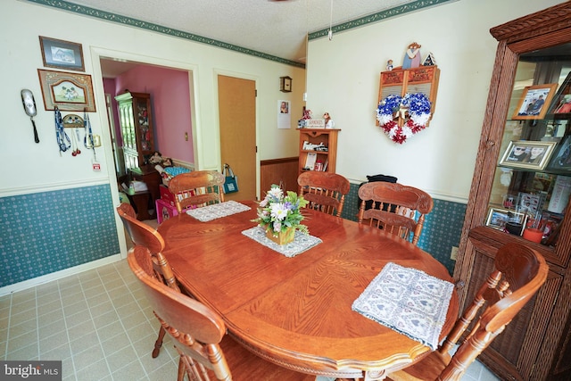 dining area with a textured ceiling