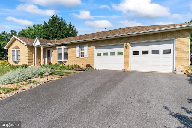 ranch-style house featuring a garage