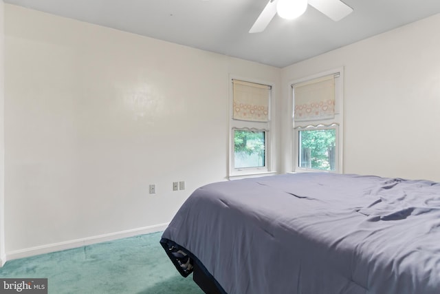 bedroom with ceiling fan and carpet flooring