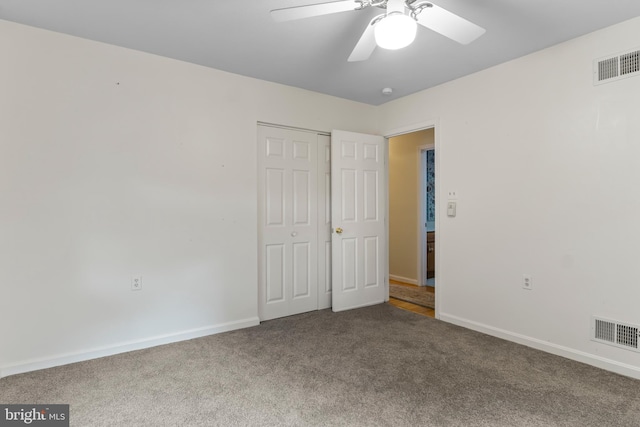 unfurnished bedroom featuring ceiling fan, carpet, and a closet