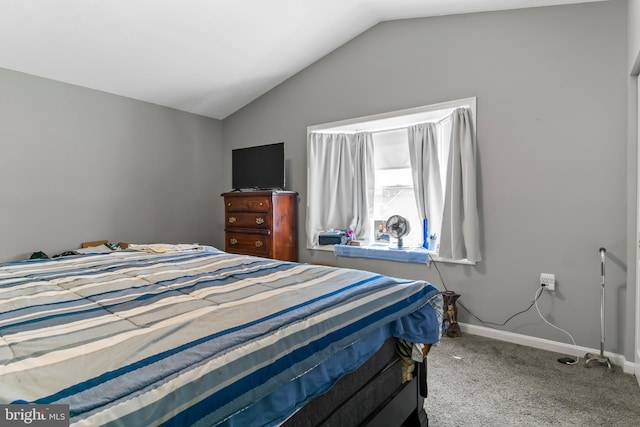 carpeted bedroom featuring lofted ceiling