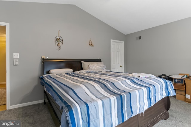 carpeted bedroom featuring lofted ceiling