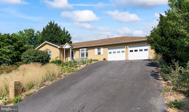 single story home with a garage