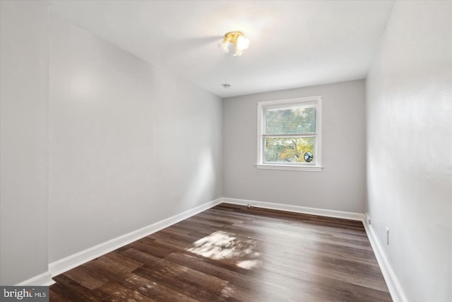 unfurnished room featuring dark hardwood / wood-style floors