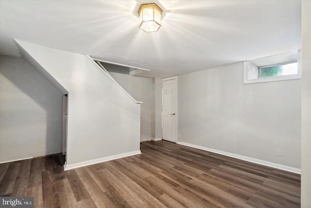 basement featuring dark hardwood / wood-style floors