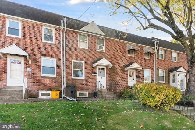 view of property with a front lawn