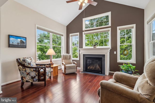 living room featuring lofted ceiling, ceiling fan, plenty of natural light, and dark hardwood / wood-style floors