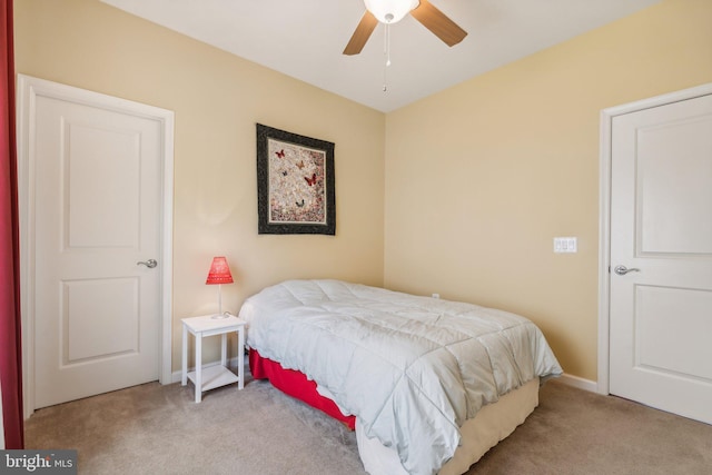 bedroom with ceiling fan and light colored carpet