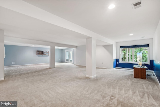 unfurnished living room with light carpet