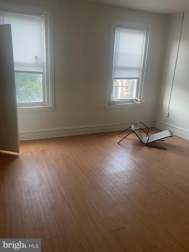 unfurnished room featuring light hardwood / wood-style floors